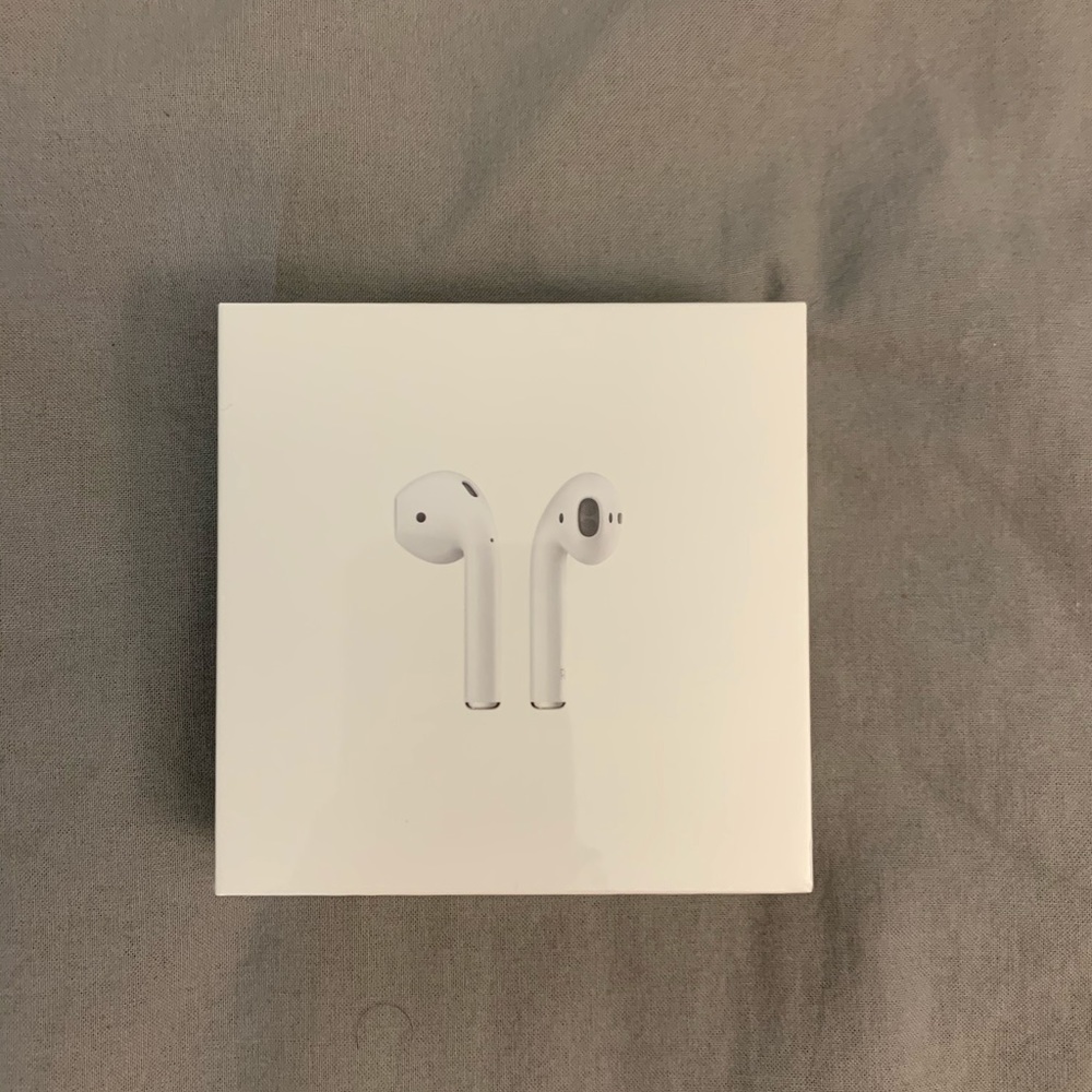 New in Box Apple AirPods with charging case